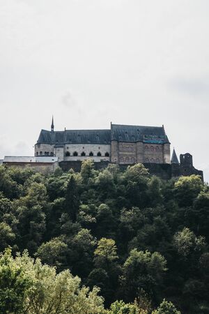Low angle over the greenery view of Vianden Castle, Luxembourg, one of the largest and finest feudal residences of the Roman and Gothic eras in Europe.のeditorial素材