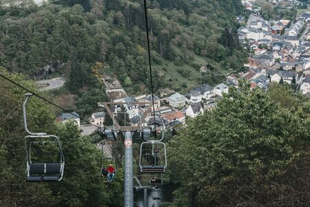 Vianden, Luxembourg - May 18, 2019: People on a chair lift in Vianden, a town in Luxembourgs...
