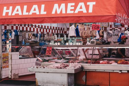 London, UK - July 16, 2019: Exterior of Halal Meat Store at Brixton Market, a community market run by local traders in the centre of Brixton, south London.のeditorial素材