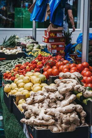 London, UK - July 16, 2019: Fresh vegetables on sale in Brixton Market, a community market run by...