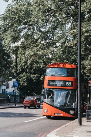 London, UK - July 16, 2019: Bus 159 towards Streatham Station on a street in Brixton, South London. Brixton is a multicultural area, with a large percentage of its population of Afro-Caribbean descendのeditorial素材