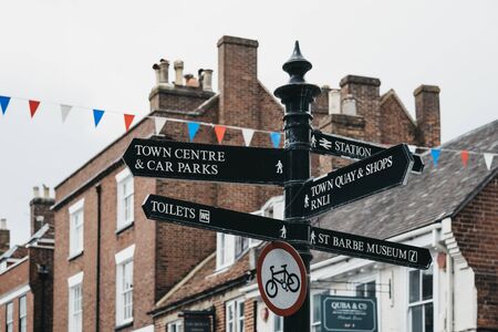 Lymington, UK - July 14, 2019: Directionals signs  on a street in Lymington, New Forest, a historic coastal town with an ancient seaport and a rich maritime history.のeditorial素材