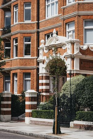 Facade of a traditional English brick house in London, UK.の写真素材