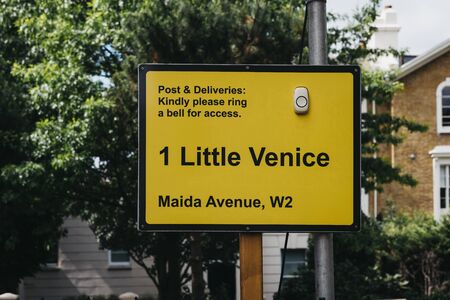 London, UK - July 18, 2019: Street name sign, a bell and delivery instructions for a boat moored in Little Venice, London, a tranquil area of the city where the Grand Union and Regentâs canals meet.のeditorial素材