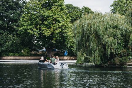 London, UK - July 18, 2019: People having a picnic on a boat on Regents Canal in Little Venice, London, a tranquil area of the city where the Grand Union and Regentâs canals meet.のeditorial素材
