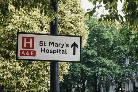 London, UK - July 18, 2019: Directional sign to St.Marys Hospital, an NHS hospital in Paddington, in the City of Westminster, London, founded in 1845.のeditorial素材