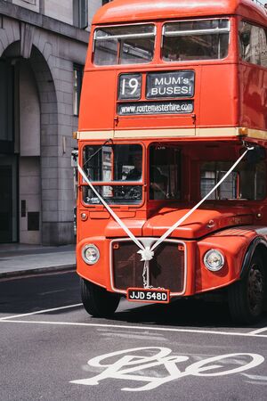 London, UK - July 18, 2019: Old Routemaster bus hired for wedding on a street in Marylebone, a chic residential area of London famous for baker Street and Madame Tussauds waxwork museum.のeditorial素材