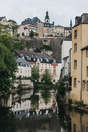 Luxembourg City,Luxembourg - May 19, 2019: Houses on the bank of river Alzette in Luxembourg, the capital of the small European nation of the same name famed for its ruins of medieval fortifications.のeditorial素材
