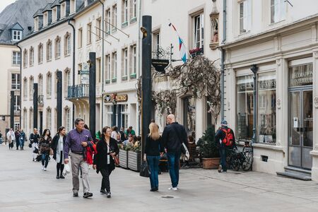 Luxembourg City, Luxembourg - May 19, 2019: People walking past shops on a street in Luxembourg, the capital of the small European nation of the same name famed for its medieval fortifications.のeditorial素材