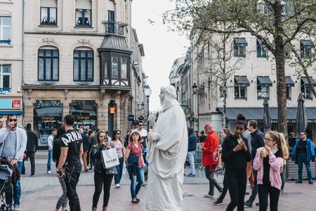 Luxembourg City, Luxembourg - May 19, 2019: People looking at live statue in city square of Luxembourg City, the capital of the small European nation of the same name famed for its fortifications.のeditorial素材