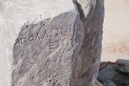 Writings on the ruins on Sacred Way in island of Delos, an archaeological site in Greece near Mykonos in the Aegean Sea Cyclades archipelago.の写真素材