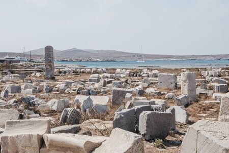 Ruins and columns on the island of Delos, Greece, an archaeological site near Mykonos in the Aegean Sea Cyclades archipelago.の写真素材