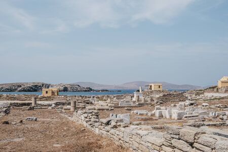 View of the ruins on the island of Delos, Greece, an archaeological site near Mykonos in the Aegean Sea Cyclades archipelago.の写真素材