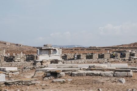 Marble bulls head on reconstructed section of the entablature on Stoa of Antigonos in the Sacred precinct of Apollo on Delos, Greece.の写真素材