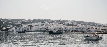 Mykonos Town, Greece - September 20, 2019: Panoramic view of boats in new port in Hora, also known as Mykonos Town, capital of the island and one of the best examples of Cycladic architecture.のeditorial素材