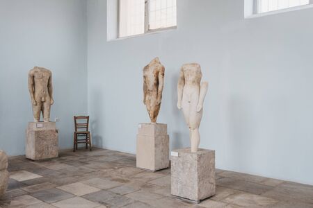 Delos, Greece - September 20, 2019: Statues inside the Archaeological Museum of Delos, a museum on...