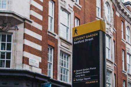 Close up of directional signs in Bedford Street, Covent Garden, London, UK, selective focus.の写真素材