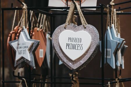 London, UK - November 26, 2019: Prosecco princess sparkly signs on sale at a stall inside Camden Market, a popular tourist attraction and the busiest retail spot in London, UK. Selective focus.のeditorial素材