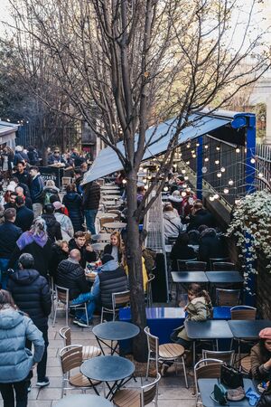London, UK - November 29, 2019: High angle view of people walking past Brood stall and cafe in Borough Market, one of the largest and oldest food markets in London.のeditorial素材