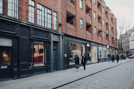London, UK - March 06, 2020: Row of shops in Covent Garden, a popular tourist area in London with...