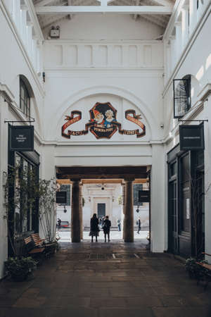 London, UK - March 06, 2020: Punch and Judy pub sign inside Central Avenue in Covent Garden Market,...