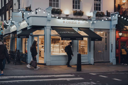 London, UK - March 06, 2020: Facade of Oree cafe in Covent Garden, an area of London famous for bars and eateries, people walking past, motion blur.のeditorial素材