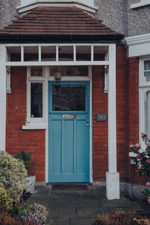 London, UK - March 22, 2020: Blue front door a traditional Edwardian house in London, UK. Edwardian houses promote simple design and an appreciation for the handmade.のeditorial素材
