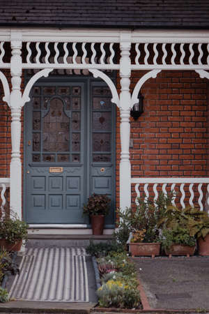 London, UK - March 22, 2020: Stained glass wooden door of a traditional Victorian house in London, UK. Stained glass remains a focal point in a Victorian home.のeditorial素材