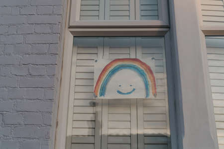 London, UK - April 12, 2020: Handmade rainbow sign displayed in a window of a house in London as people support each other during lockdown because of Coronavirus.のeditorial素材
