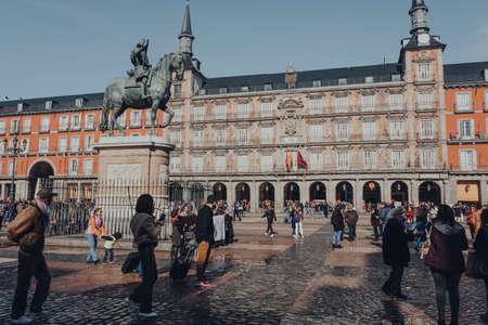 Madrid, Spain - January 26,2020: Tourists walking in Plaza Mayor, a major public space in the heart of Madrid, the capital of Spain renowned for its rich repositories of European art.のeditorial素材