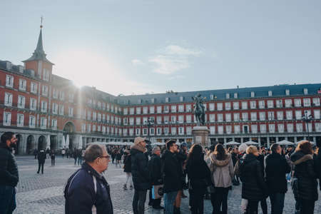 Madrid, Spain - January 26,2020: Group of tourists on Plaza Mayor, a major public space in the heart of Madrid, Spain.のeditorial素材