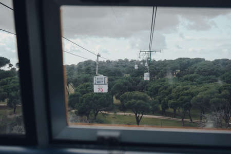 Madrid, Spain - January 26, 2020: View from cable car window over other cabins on Teleferico de Madrid, or Madrid Cable Car, a gondola lift in Madrid, Spain, built by Von Roll and opened in 1969 .のeditorial素材