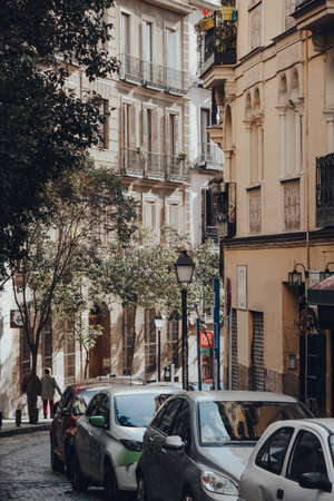Madrid, Spain - January 26, 2020: Cars parked on a narrow street in Madrid, capital of Spain renowned for its rich repositories of European art, on a sunny winter dayのeditorial素材