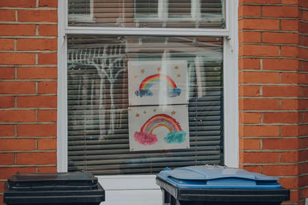 London, UK - May 30, 2020: Rainbow signs publicly displayed in front window of a house in London as people support each other during lockdown because of Coronavirus.のeditorial素材