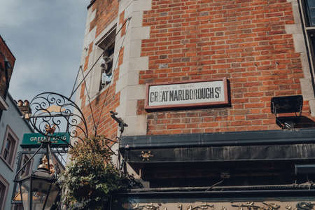 London, UK - June 13, 2020: Old street name sign on a brick wall of a building in Great Marlborough Street in Soho, London, an area of Central London famous for its shops and restaurants.のeditorial素材