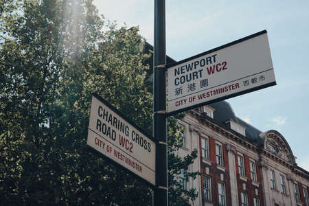 London,UK - June 13, 2020: Street name signs on corner of Charing Cross road and Newport Court, City of Westminster, a borough occupying much of central area of London including most of the West End.のeditorial素材