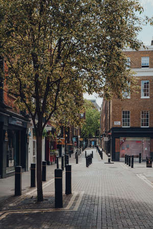 London, UK - June 13, 2020: Empty street and closed shops and cafes in Covent Garden, a typically busy area of London famous for its retails, restaurants and cafes, on a sunny summer day.のeditorial素材