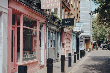 London, UK - June 13, 2020: Row of pastel coloured closed shops and empty street in Covent Garden, a...