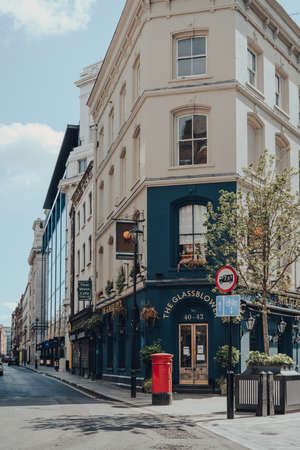 London, UK - June 13, 2020: Empty street and facade of closed Glassblower pub in Soho, a famous area of London with numerous of bars and restaurants.のeditorial素材