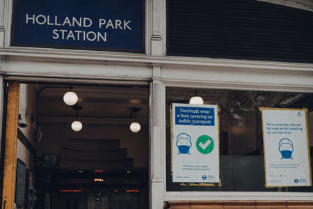 London, UK - June 20, 2020: Cars parked in front of white Victorian houses on a street in Holland park, an affluent area of West London favoured by celebrities.のeditorial素材