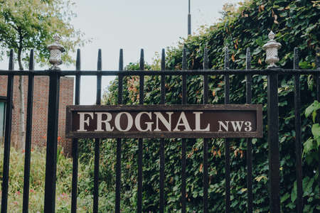 London, UK - July 02, 2020: Street name sign on a metal fence on Frognal, Hampstead, an affluent...