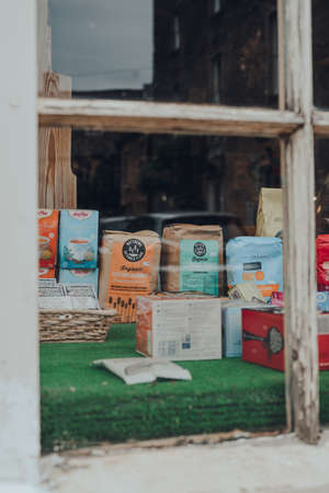 Stow-on-the-Wold, UK - July 6, 2020: View through window of products on window display of Organic...