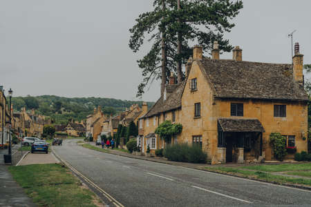 Broadway, UK - July 07, 2020: View of the High Street in Broadway, a historic village and civil parish within the Cotswolds in the county of Worcestershire, England.のeditorial素材