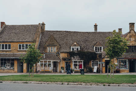 Broadway, UK - July 07, 2020: Shops on a High Street in Broadway, a historic village and civil...