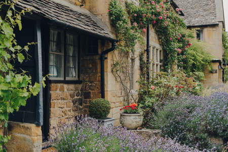 Front garden of a traditional limestone house in Broadway, Worcestershire, Cotswolds, UK.