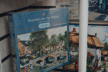 Broadway, UK - July 07, 2020: Gibsons puzzles on sale in a window of a shop in Broadway, a large...