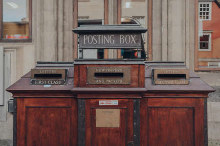 Oxford, UK - August 04, 2020: Retro post box on a street in Oxford, a city in England famous for its...