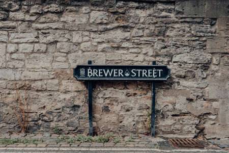 Oxford, UK - August 04, 2020: Street name sign on Brewer Street in Oxford, a city in England famous for its prestigious university, established in the 12th century.のeditorial素材