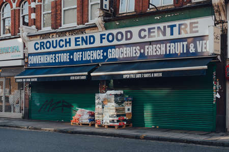London, UK - August 20, 2020: Fruits and vegetables on a pallet in front of a closed Food Centre in Crouch End, an area in North London traditionally favoured by creatives and families.のeditorial素材