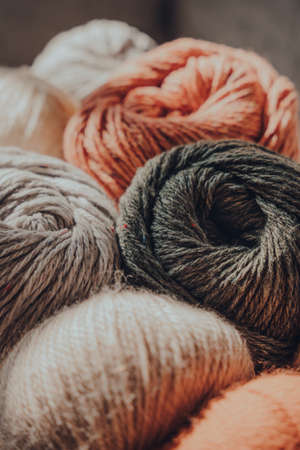 Close up of earth coloured coloured skeins of wool yarn, selective focus.の写真素材
